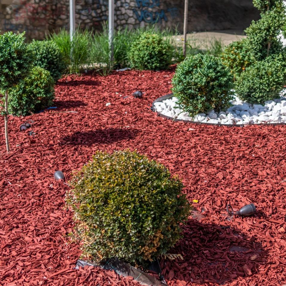 Red mulch in garden bed